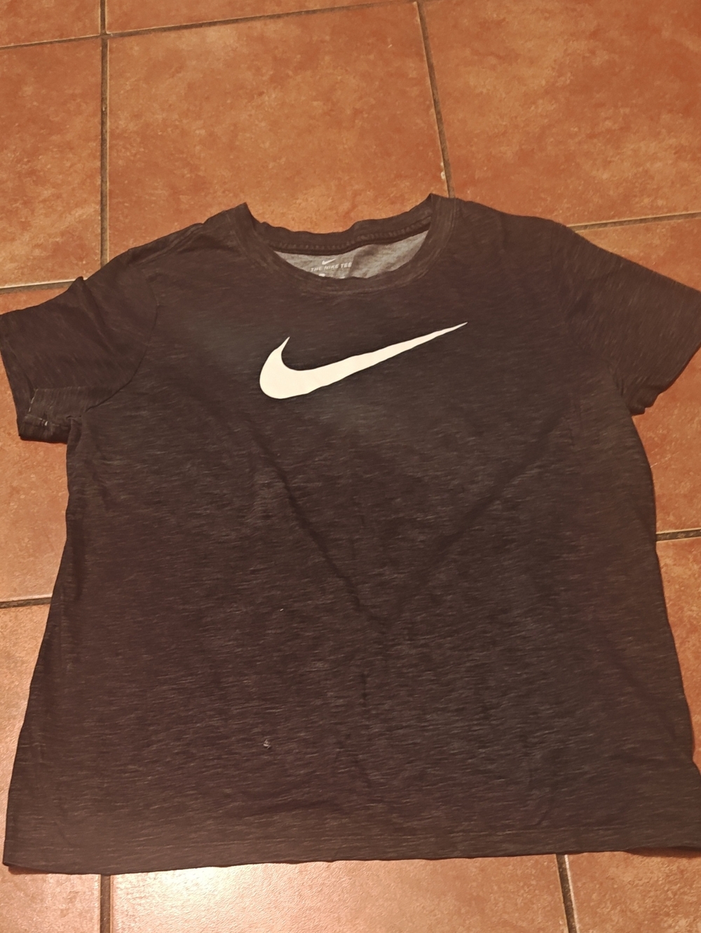 Nike Womenโs Black Short Sleeve Tee with White Swoosh